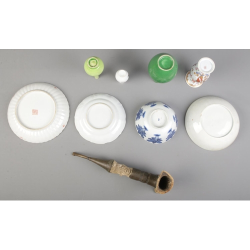 115 - A quantity of mostly oriental ceramics. Includes Celadon dog of fo, blue & white tea bowl, Cantonese... 