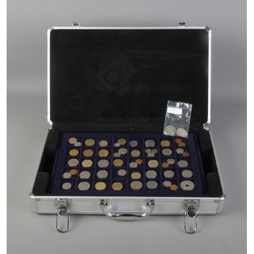 122 - A coin collection case including 5 coin trays with a selection of coins from around the world includ... 