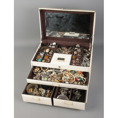 123 - A leather jewellery box with contents of assorted costume jewellery to include pair of Justin Pewter... 