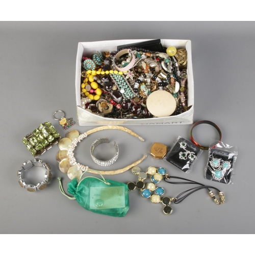 132 - A large quantity of assorted costume jewellery and accessories to include necklaces, Stratton compac... 