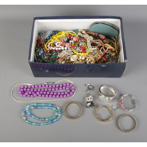 134 - A large quantity of costume jewellery and accessories to include beaded necklaces, keyrings, bangles... 