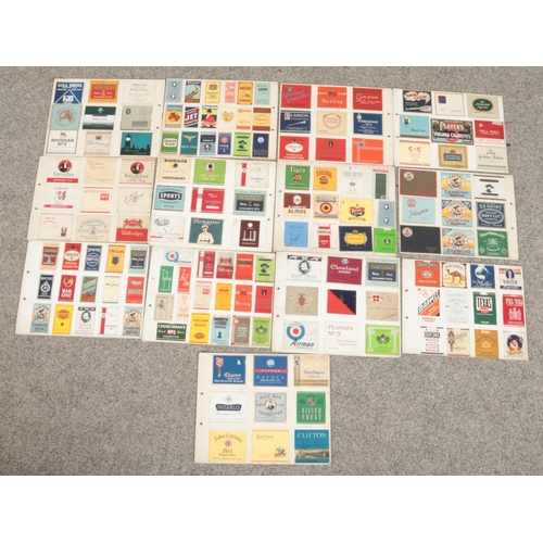 135 - A large quantity of vintage cigarette packets mounted on card (double sided).