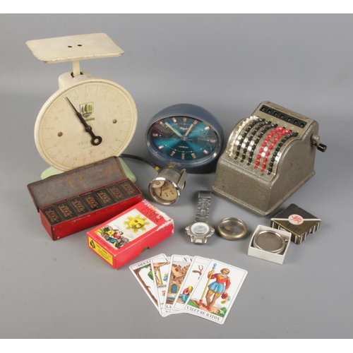 137 - A box of collectables. Includes Spinney scales, Bowler mechanical counter, Tarot cards, Casio Quartz... 