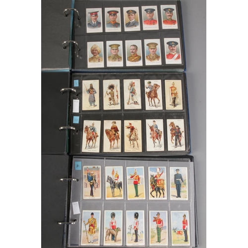 17 - Three albums of complete cigarette card sets including Uniforms Of The Territorial Armies, Military ... 