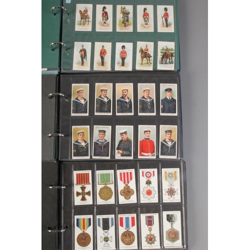 17 - Three albums of complete cigarette card sets including Uniforms Of The Territorial Armies, Military ... 