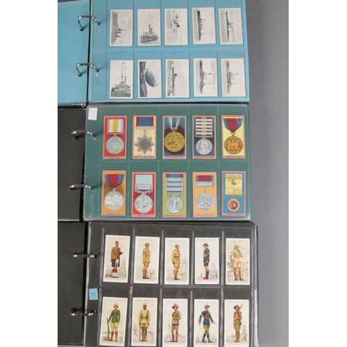 17 - Three albums of complete cigarette card sets including Uniforms Of The Territorial Armies, Military ... 