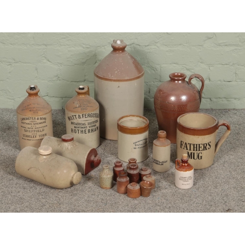 170 - A collection of stoneware flagons, pots and hot water bottles including Rotherham and Sheffield exam... 