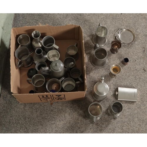 181 - A box of assorted pewter and silver plate to include tankards, candlesticks, flasks etc.