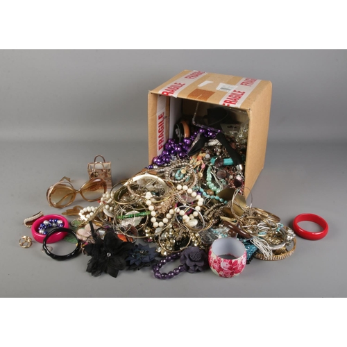 208 - A large quantity of costume jewellery including brooches, necklaces, bracelets, rings, hair clips et... 