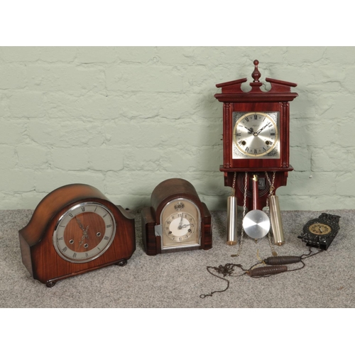 212 - A collection of clocks featuring a Highland pendulum wall clock, The Alexander Clark Co mantel clock... 