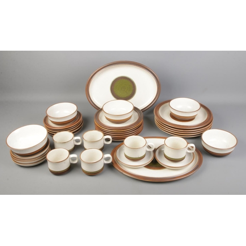 214 - A collection of Denby Potters Wheel ceramics to include six tea cups, saucers, bowls, etc. Approx. 3... 