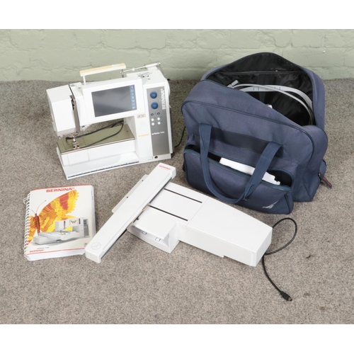 217 - A Bernina Artista 730 sewing machine with carry case, accessories and manual.