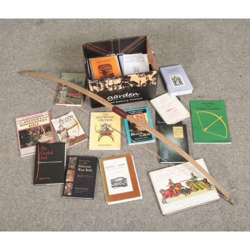 223 - A large quantity of archery an medieval weaponry books including Slazenger longbow