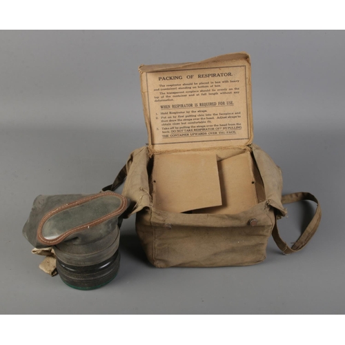 33 - World War II civilian issue respirator in original Canvas and cardboard box