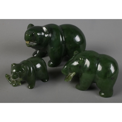 41 - Three graduated jade/nephrite carved bears holding fish in their mouths. Largest example (4cm)
