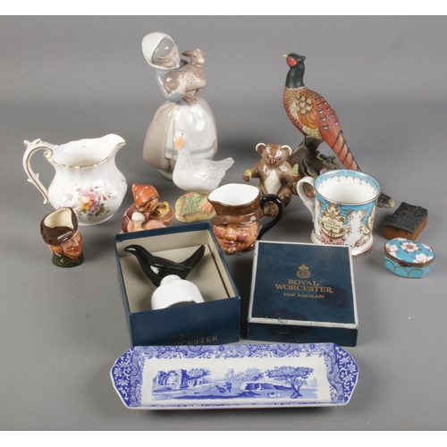 58 - A quantity of ceramics. Includes Royal Crown Derby Pheasant, Beswick Koala, Nao by Lladro, Goebel, e... 