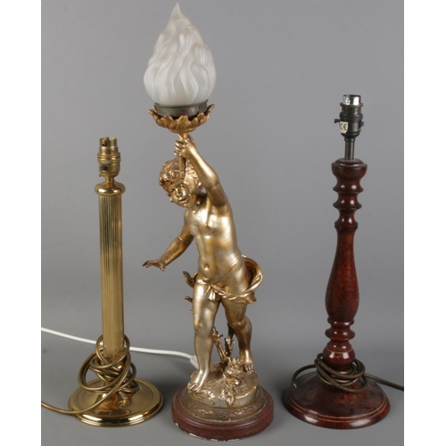 62 - Three table lamps. Includes gilt metal example formed as a cherub holding a torch, etc.