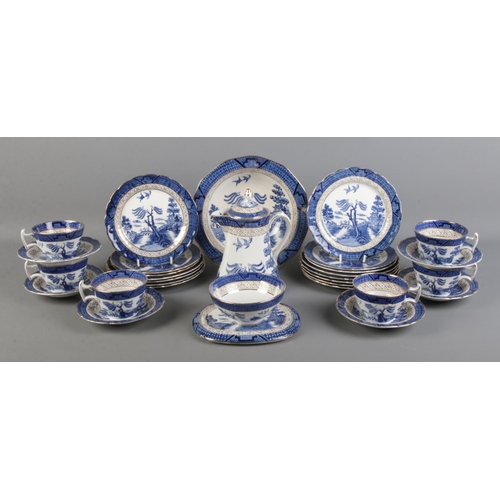 69 - A quantity of Booth's Real Old Willow dinnerwares, to include cups, saucers, sugar bowl and plate st... 