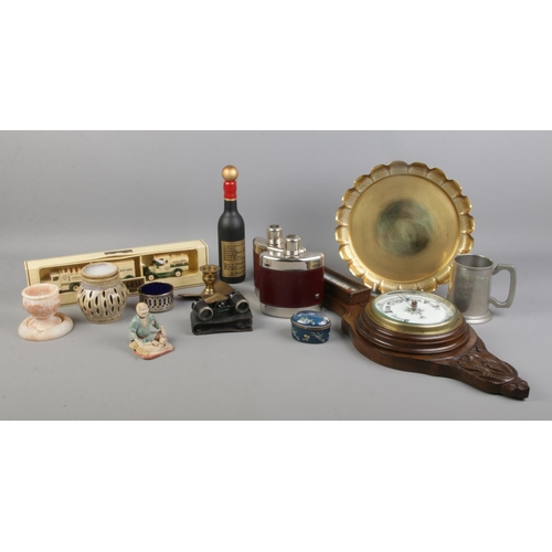 74 - A quantity of collectables, to include barometer, hip flasks, hinged pill box and propeller candlest... 