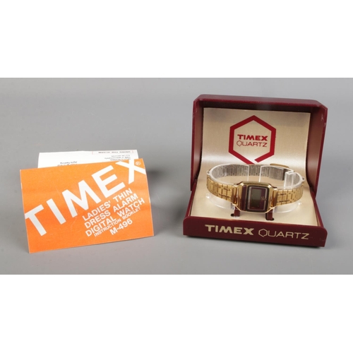 373 - A ladies Timex quartz dress alarm digital wristwatch, in box with booklet.