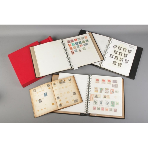 79 - A quantity of part filled stamp albums with stamps from around the world