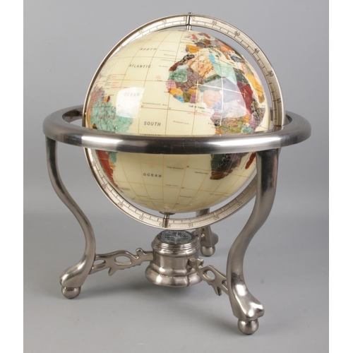 87 - A modern gemstone globe, on chromed base, comprising of countries being composed of minerals and sem... 