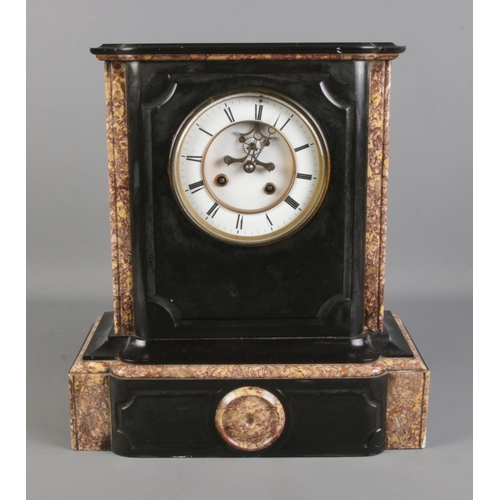 88 - A black slate and marble mantel clock, with O. Berger movement on white enamel dial and Roman Numera... 