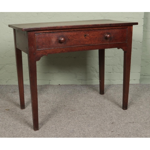 483 - A nineteenth century oak side table with lower drawer and tapering legs.