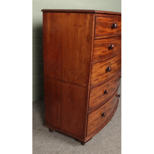 484 - A Victorian mahogany bow fronted splitting chest of two over four drawers, raised on casters. Height... 