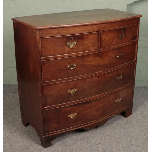 491 - A Georgian mahogany bowfront splitting chest of two over three drawers. (110cm x 107cm)