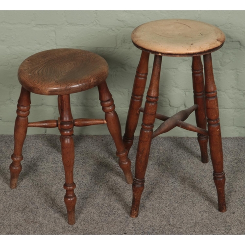 494 - Two turned oak stools.