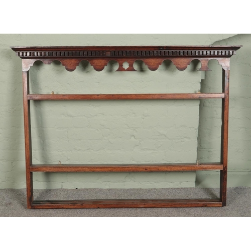 497 - A carved oak delft rack along with an oak dresser top.