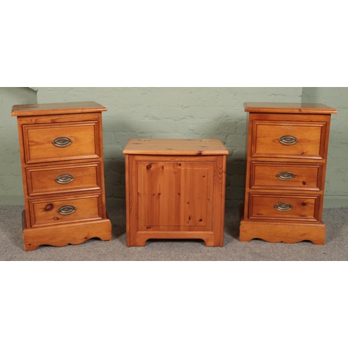 503 - A pair of small pine bedside cabinets, together with a lift top blanket/laundry box.