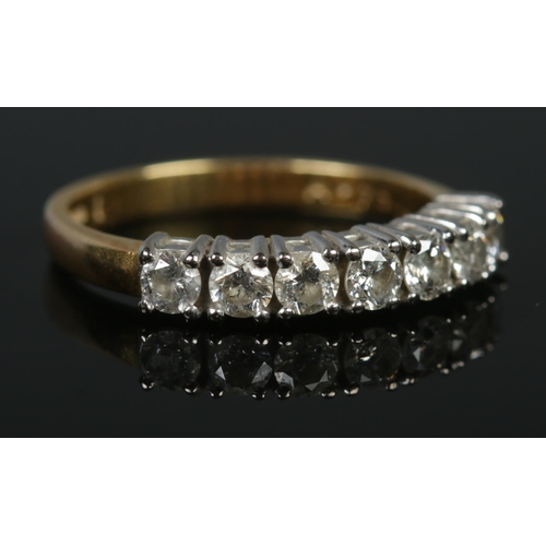 116 - An 18ct gold seven stone diamond ring. Size M 1/2. 3.56g. Approximately diamond 0.75ct in total.