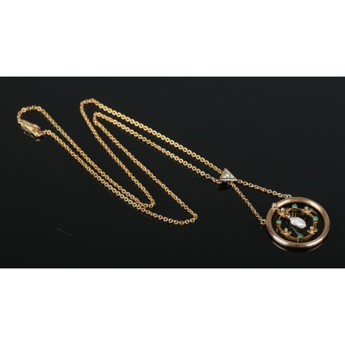 102 - A 14ct gold, pearl and emerald pendant on 14ct gold chain. Stamped 585 with makers mark for H&S. 4.5... 