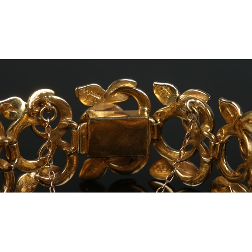 109 - A 9ct gold textured bracelet of floral design, by Cropp & Farr. 35.39g.