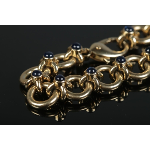 110 - A 9ct gold bracelet by Deakin & Francis, set with cabochon sapphire stones. Length 20cm, Weight 37.3... 