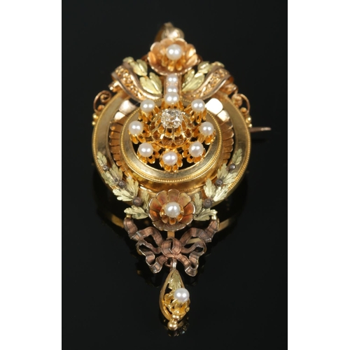 112 - A French 18ct gold pendant/brooch set with seed pearls and central diamond. Length 8cm. 17.24g.
