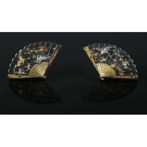 113 - A pair of Japanese Shakudo dress studs formed as hand fans.