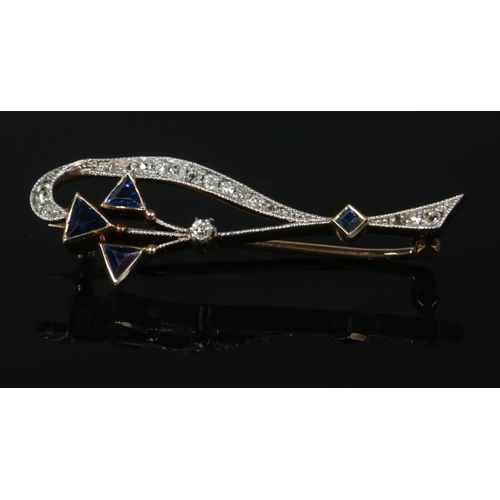 115 - An Art Deco 15ct gold diamond and sapphire brooch. 3.16g.