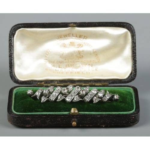 119 - An antique gold, silver and diamond brooch. With fitted case for HL Brown, Sheffield. 6.52g.