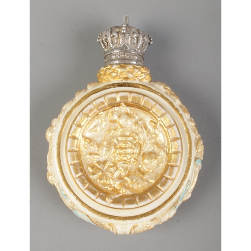 12 - A blush ivory scent bottle commemorating Queen Victoria's 1887 Golden Jubilee. Having white metal sc... 