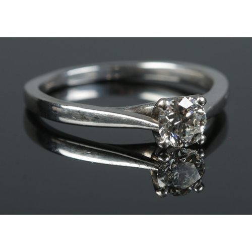 125 - An 18ct white gold diamond solitaire ring. The round brilliant cut diamond 0.5ct. With certificate. ... 