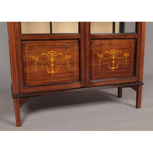 145 - An Edwardian Sheraton Revival mahogany display cabinet. With astragal glazed door and painted decora... 