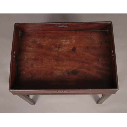 146 - A 19th century mahogany tray to table raised on four square cut legs.
