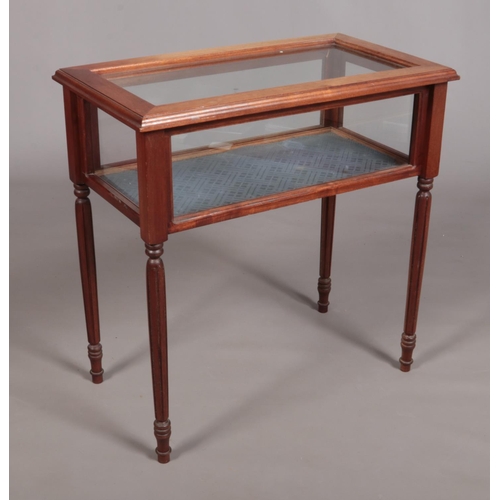 147 - A small bijouterie table raised on four reeded tapering supports. Height 71.5cm, Width 71cm, Depth 4... 