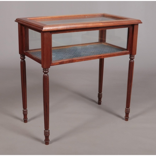 147 - A small bijouterie table raised on four reeded tapering supports. Height 71.5cm, Width 71cm, Depth 4... 