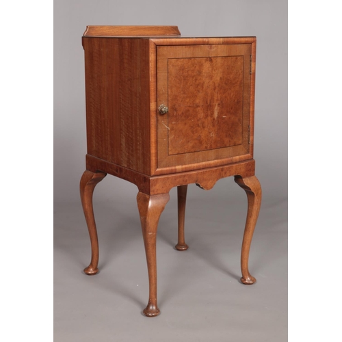 149 - An Edwardian walnut bedside cabinet raised on four cabriole supports. Height 80cm, Width 42cm, Depth... 