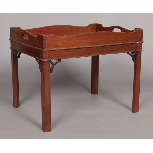 155 - A 19th century mahogany tray top table raised on four square cut legs. Height 52cm, Width 66cm, Dept... 
