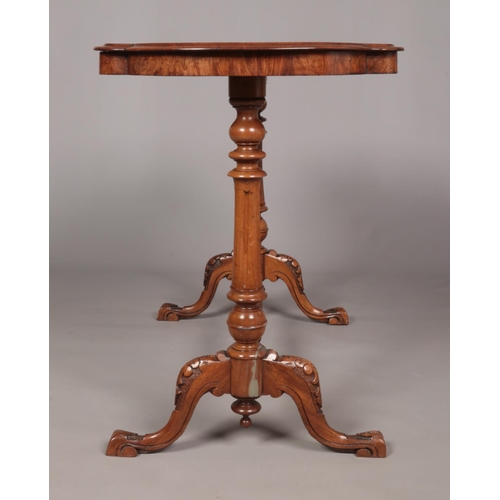 158 - A Victorian burr walnut centre table. With quarter veneered top and raised on turned and carved supp... 